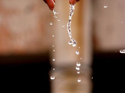 Close-up of hands in a graceful, flowing motion.
